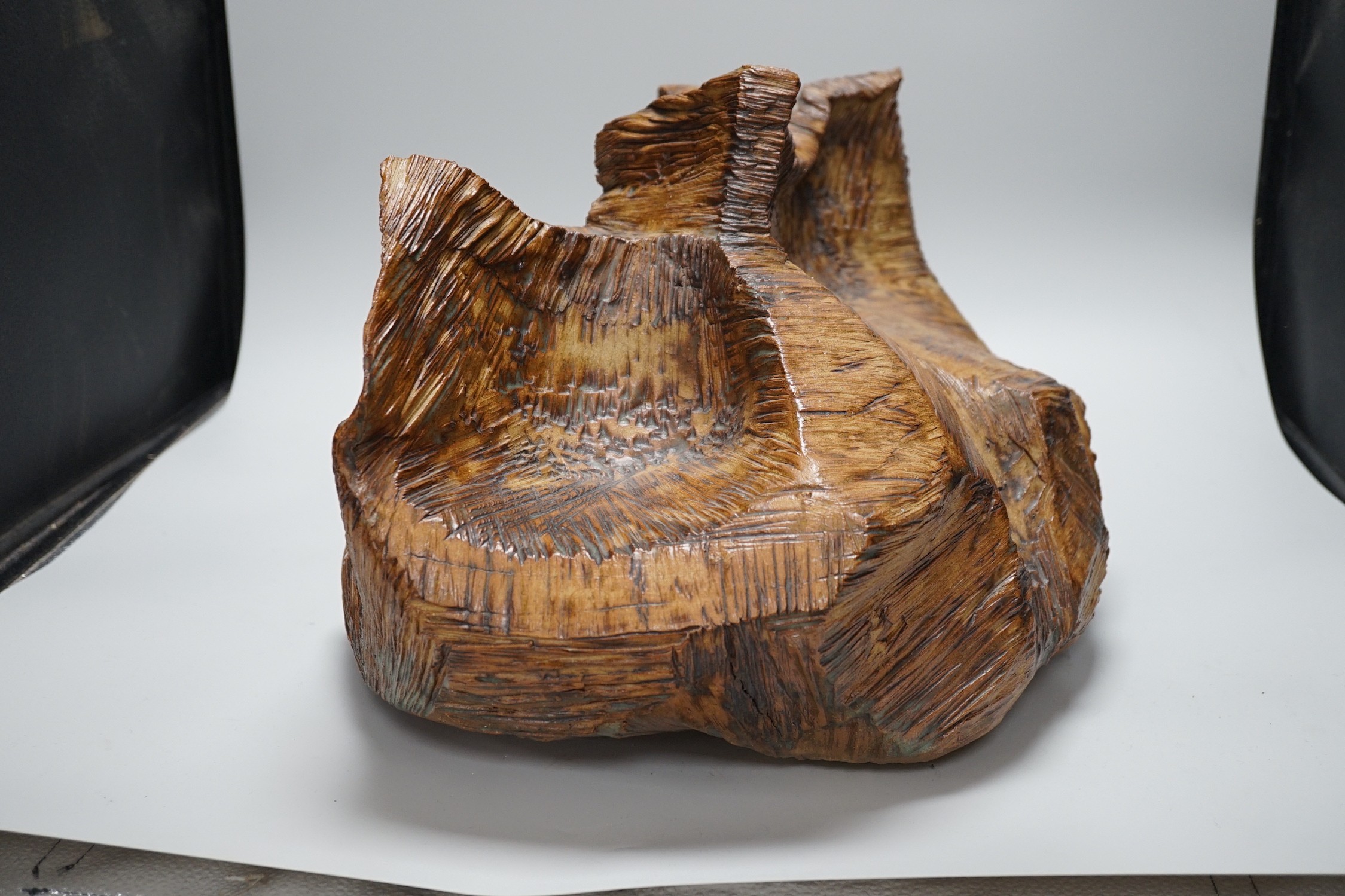 Ruth Sulke - a studio pottery copper-glaze abstract sculpture of a simulated hewn and chisled log, 43cms wide x 28.5 high